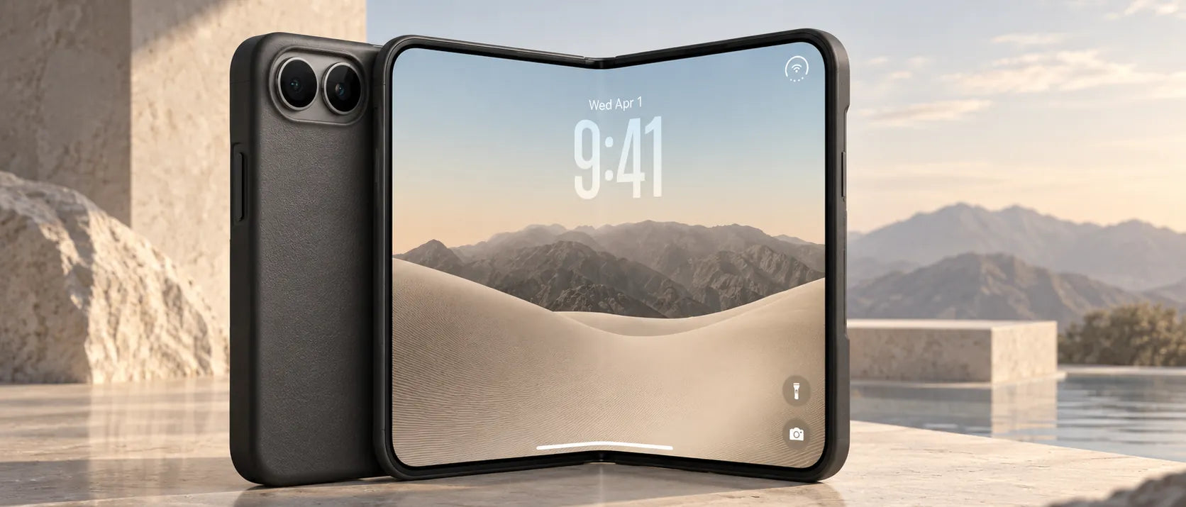 An iPhone Duo in a black case on a stone ledge beside a pool, mountains beyond